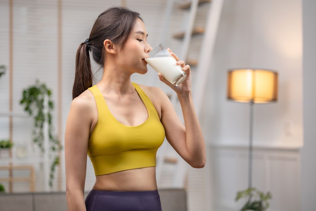 Woman drinking  The Best Dairy Products milk after a workout 
