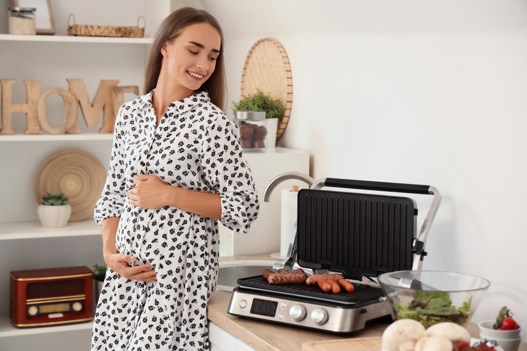 Pregnant woman cooking