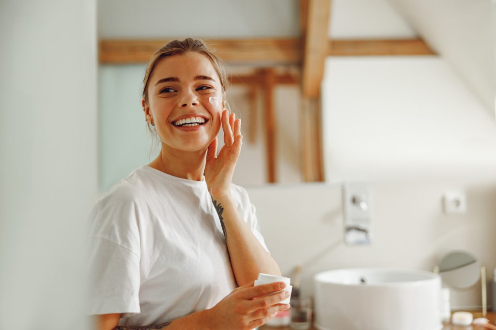 Women with facial cream