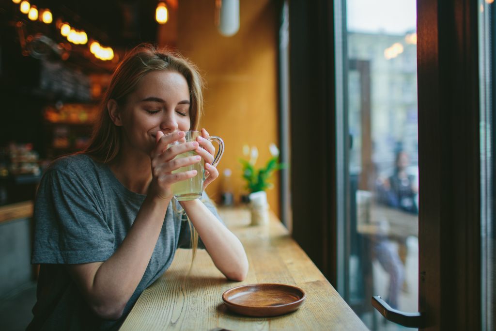 Woman drinking hot tea 