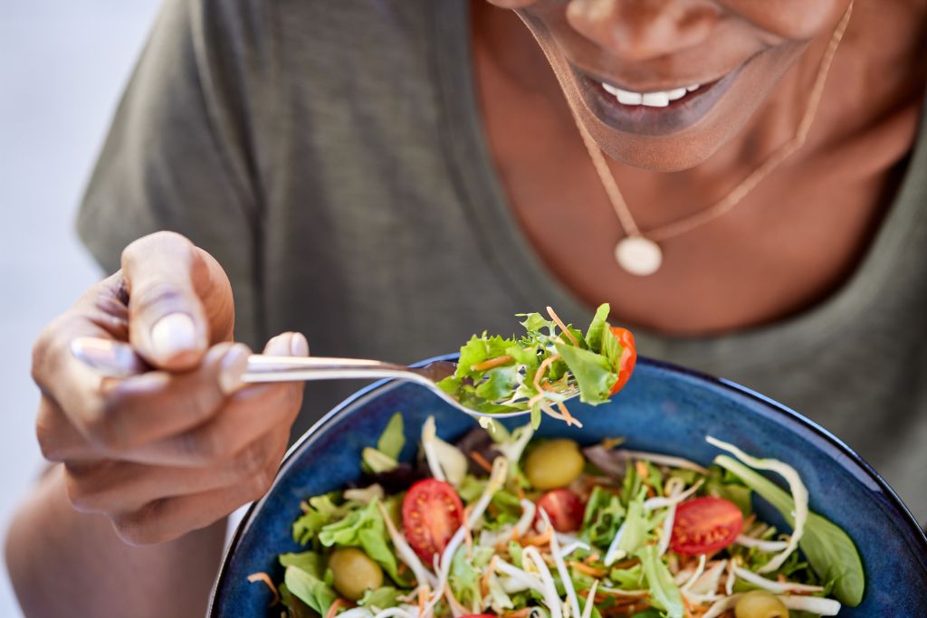 Woman eating salad 