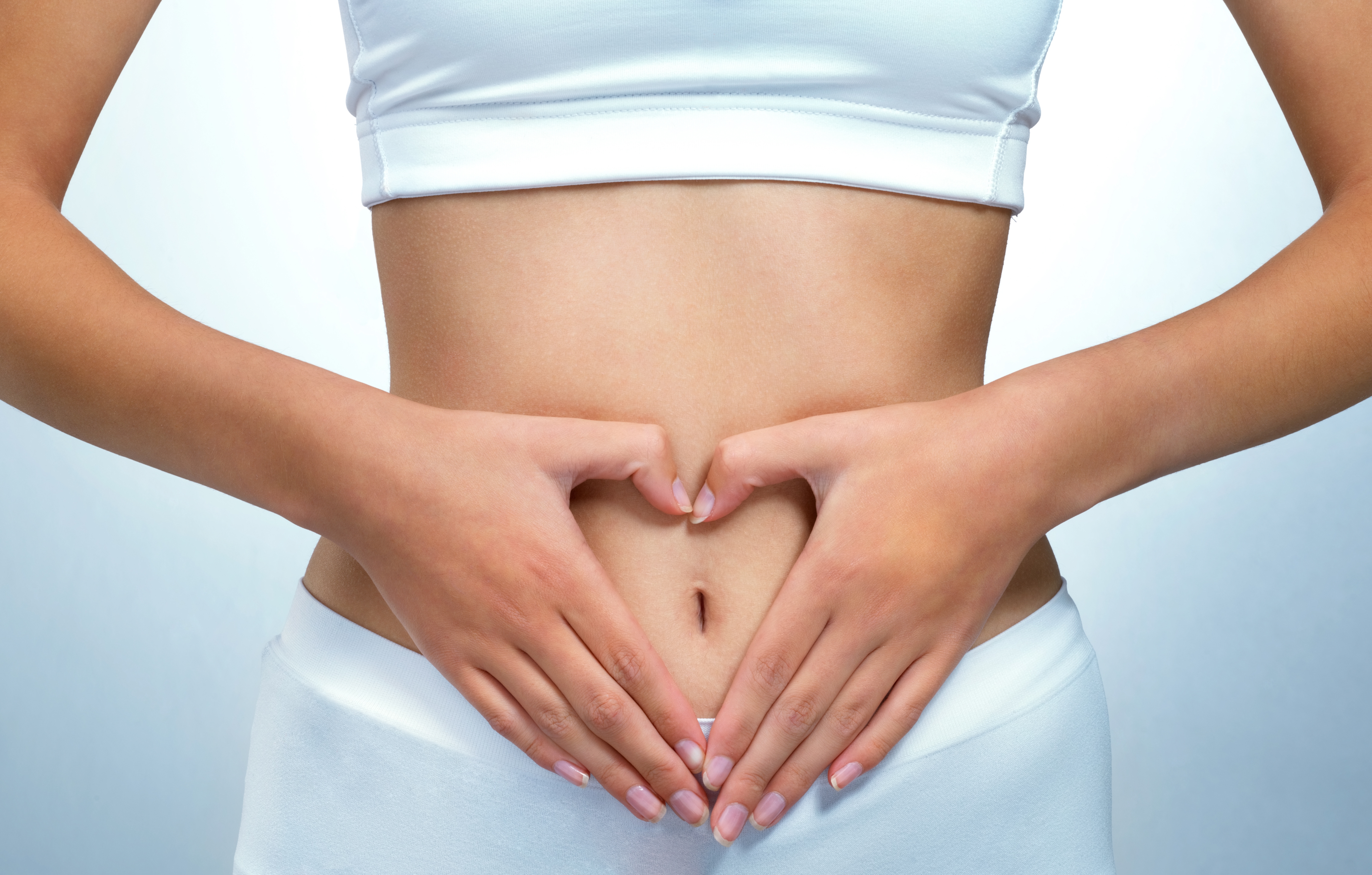 Woman with hands on stomach 