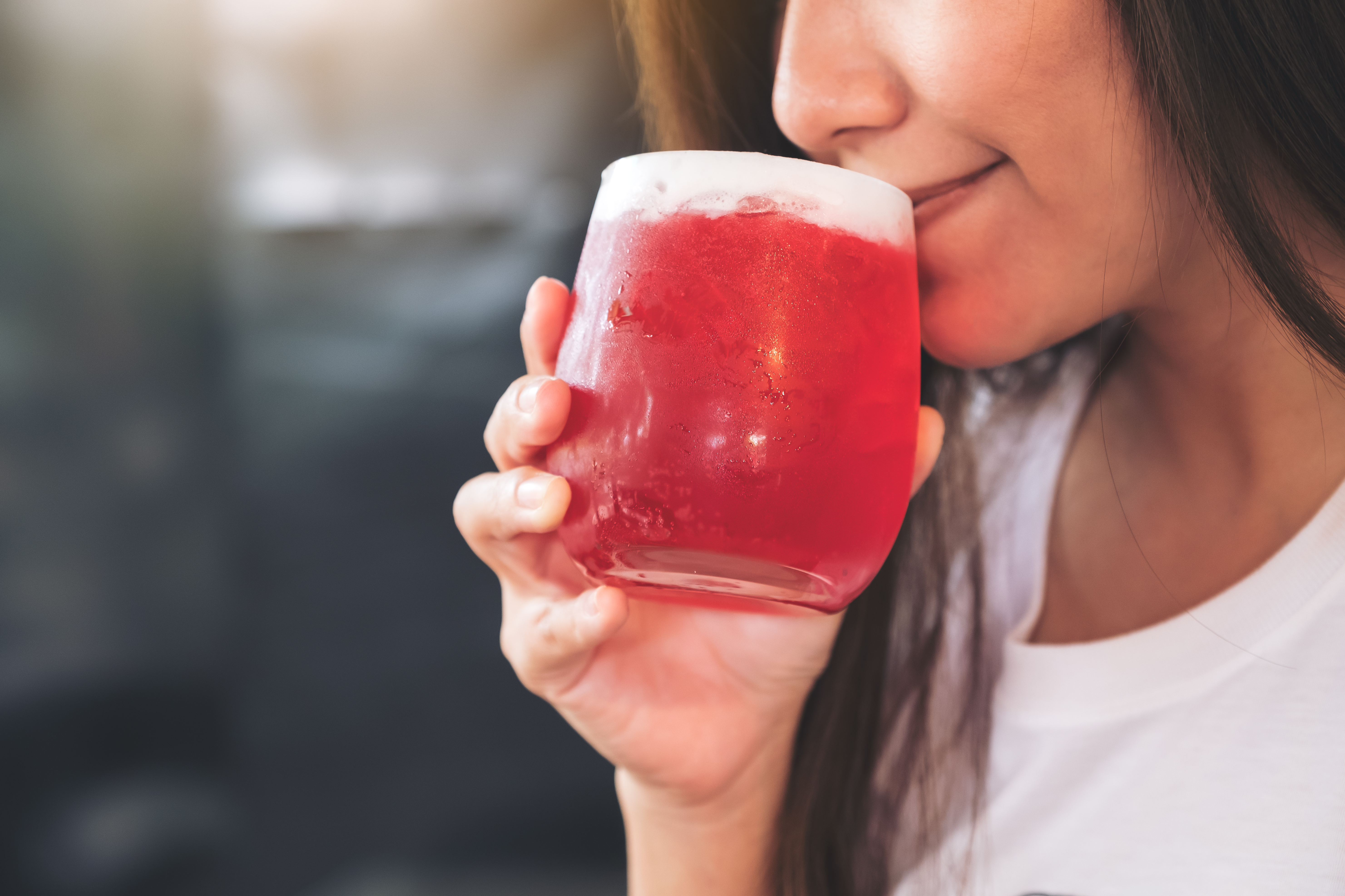 Woman drinking hibiscus tea 