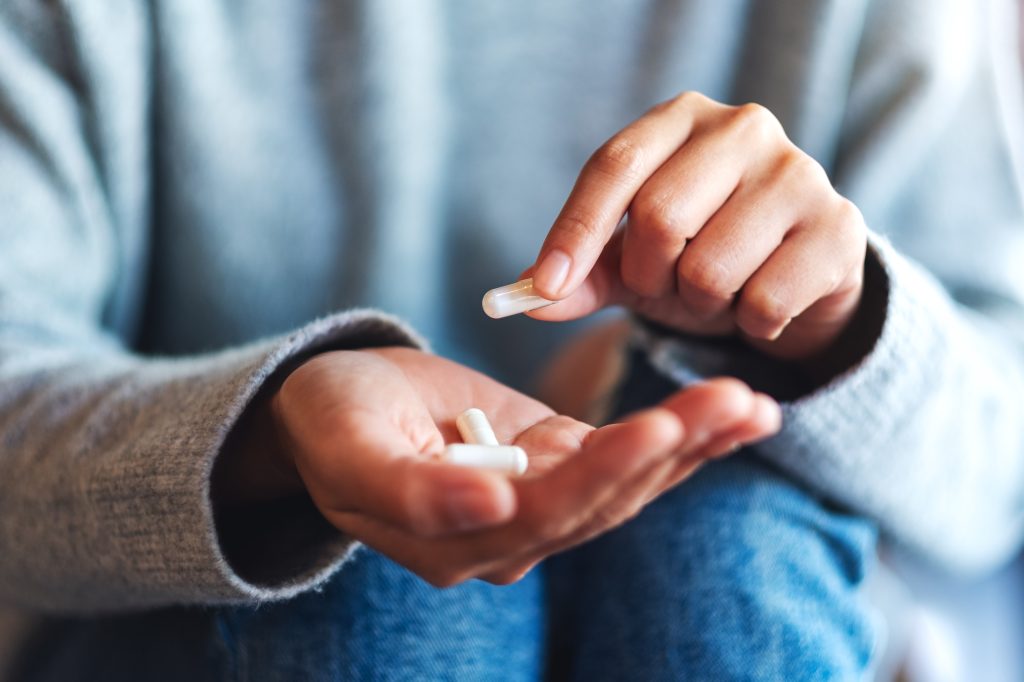 Hand holding capsules