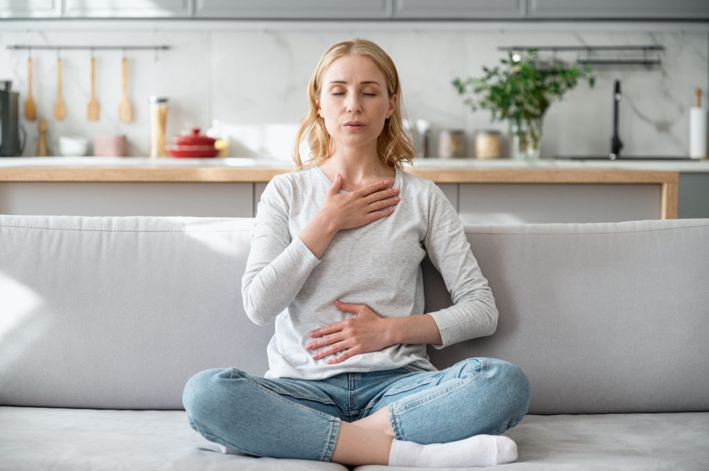 Woman practicing deep breathing   