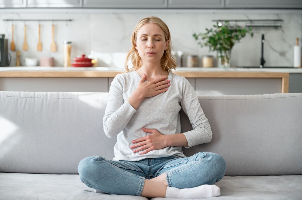 Woman practicing deep breathing