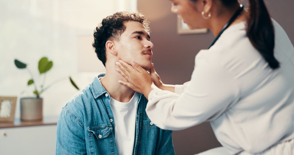 Doctor checking neck