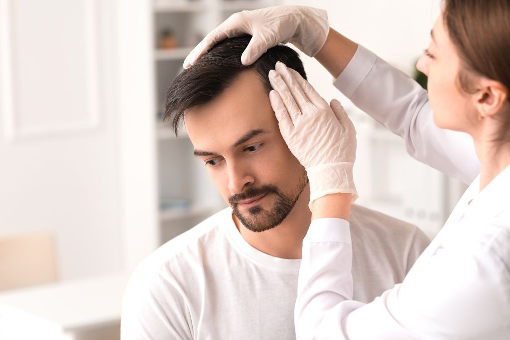 Doctor examining hair  