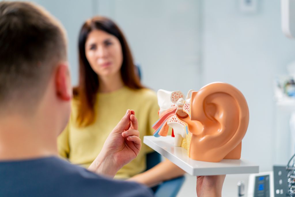 Woman talking to doctor