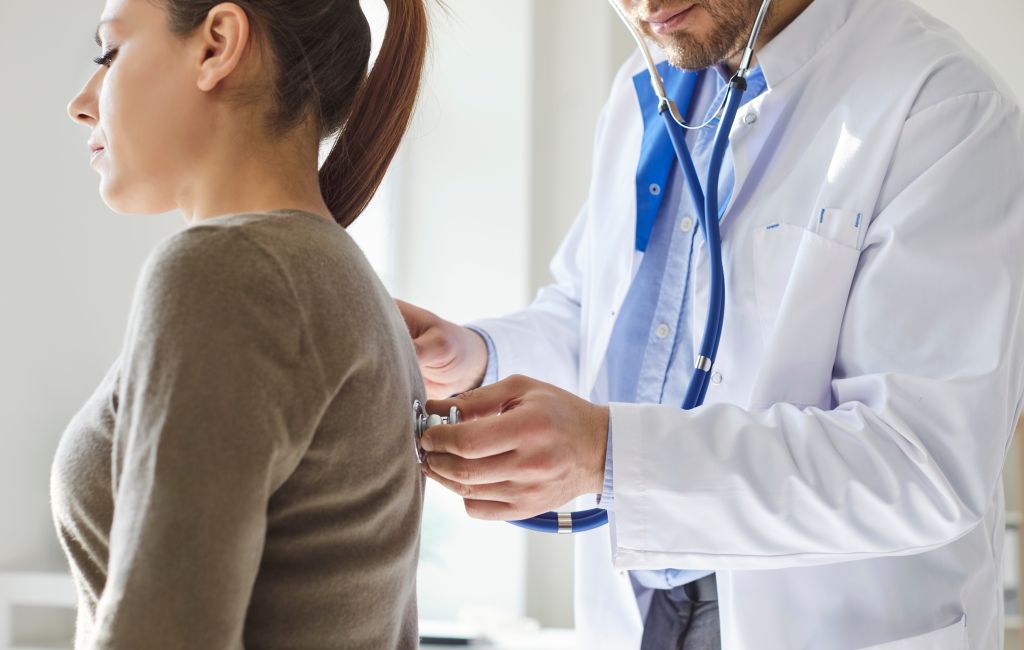 Doctor checking respiratory health

