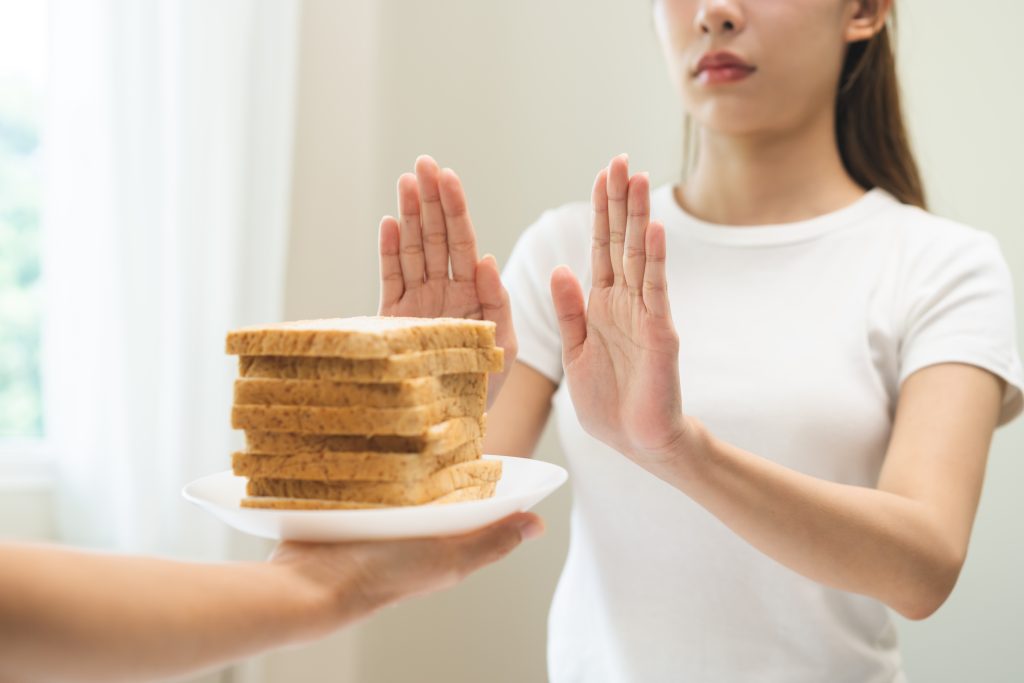 Woman saying no to bread
