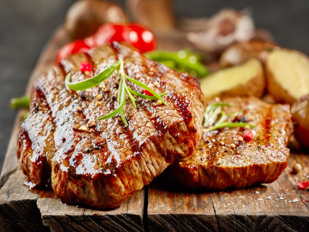 Grilled steak on a cutting board