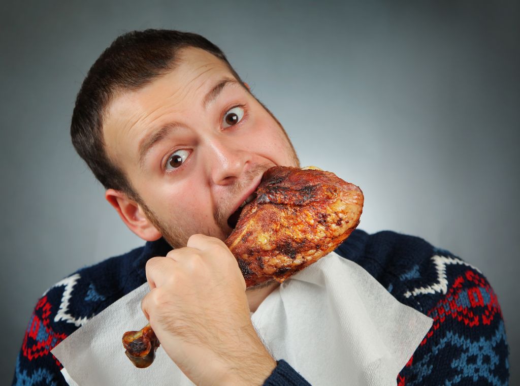 Man eating meat   