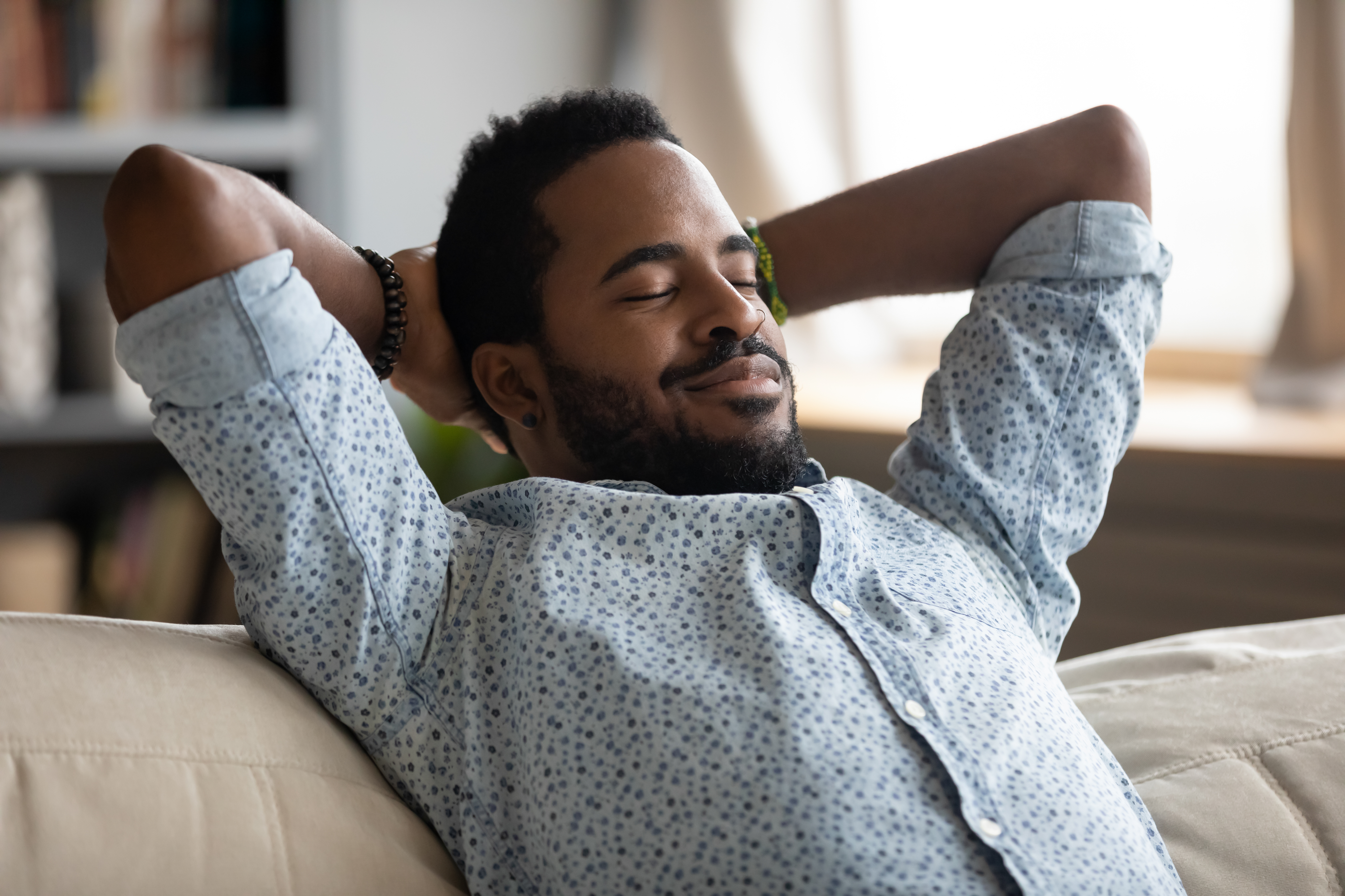 Man relaxing on a sofa 