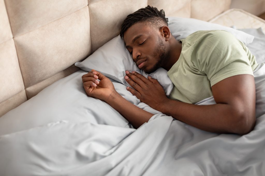 Man sleeping in a bed
