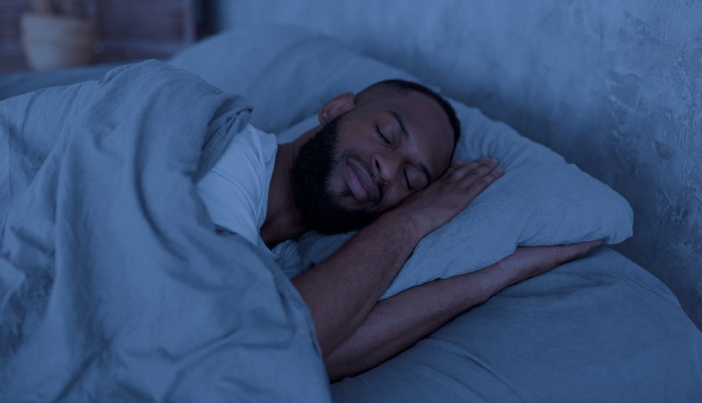 a man sleeping in bed