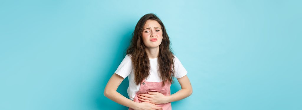 Woman holding her stomach