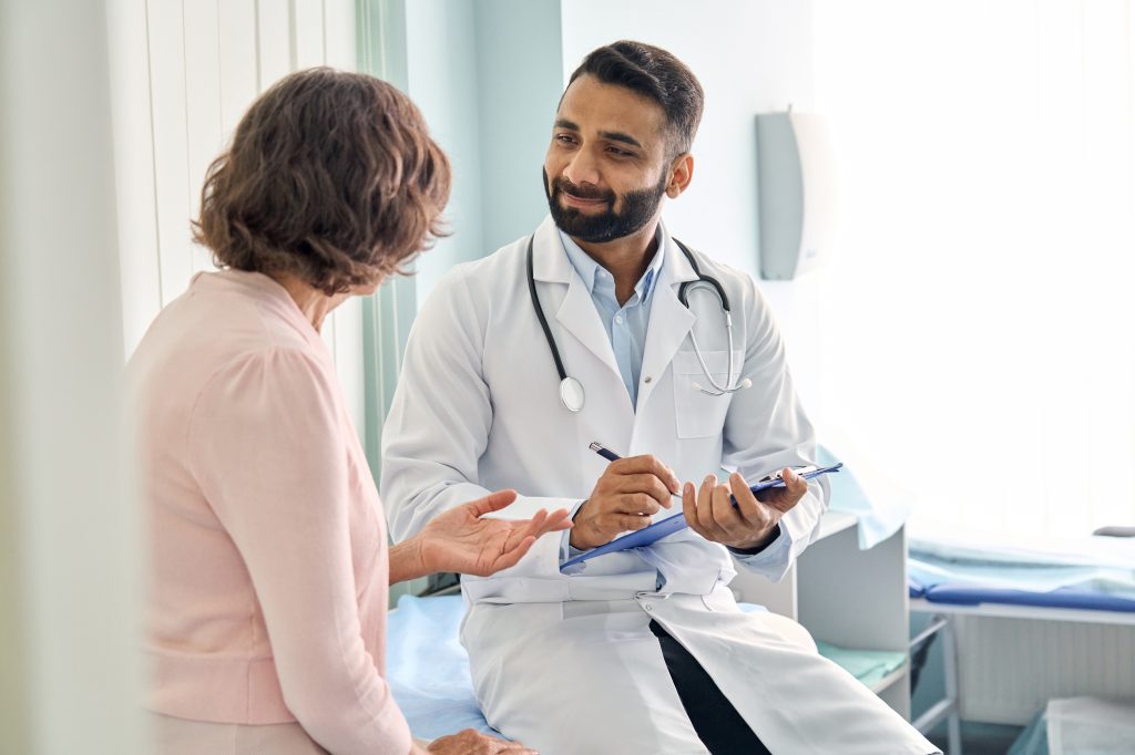 Woman talking to doctor
