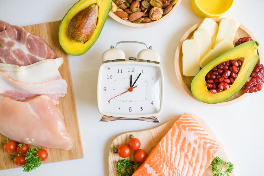 Clock surrounded by keto foods