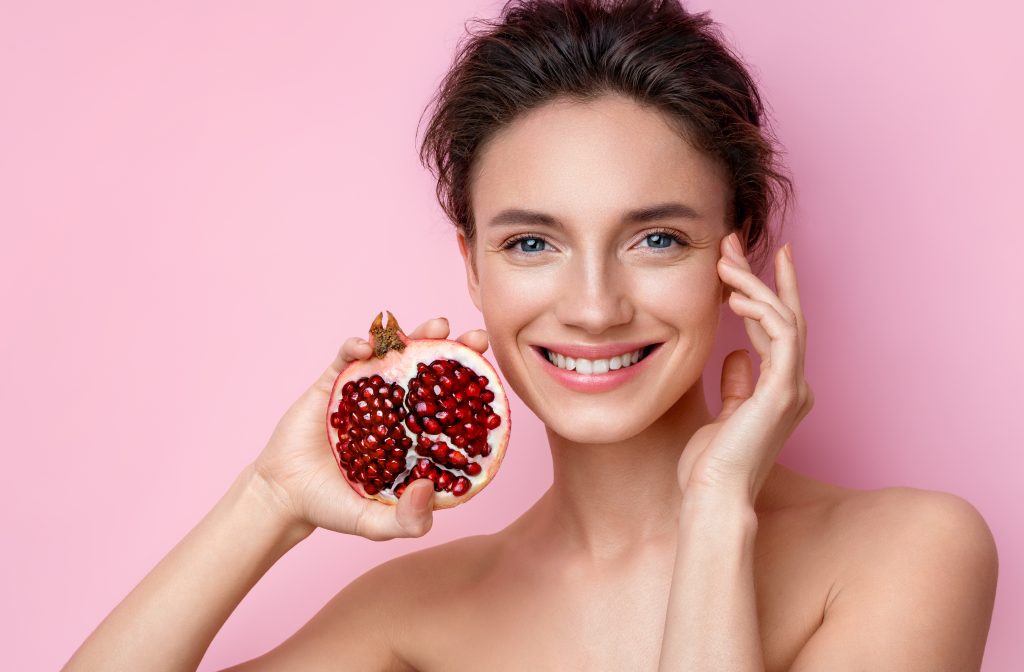 Woman holding a pomegranate 