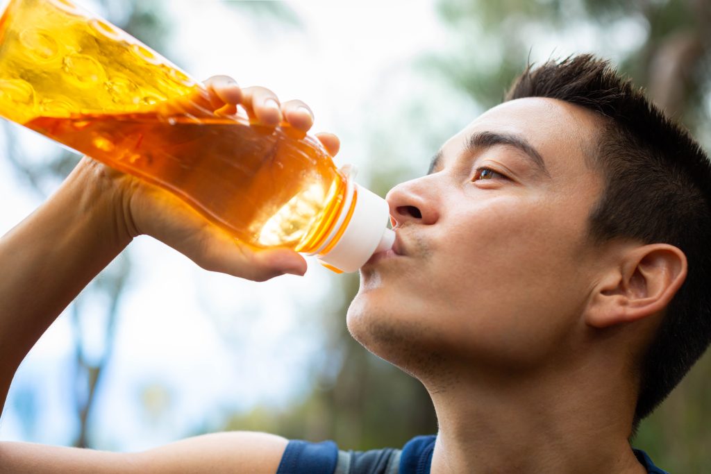 Man drinking electrolyte drink