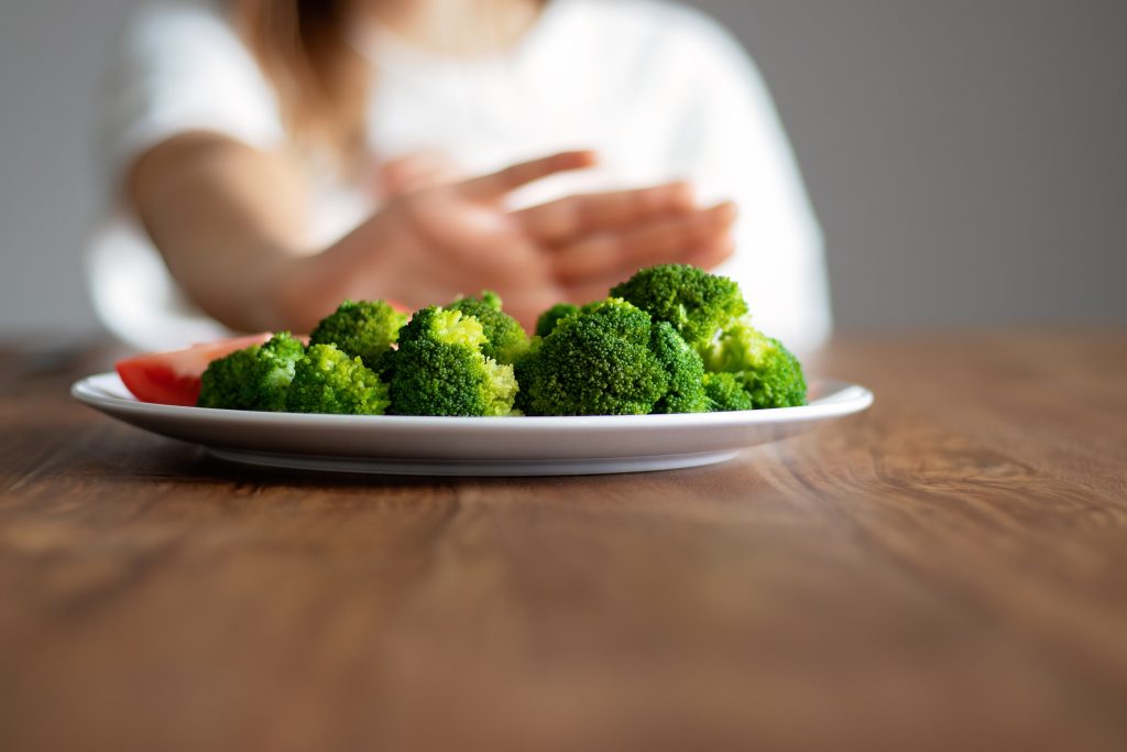 Person saying no to veggies