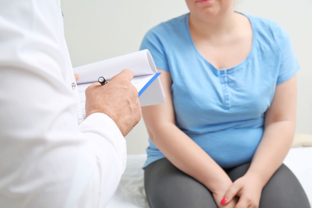 Woman talking to doctor