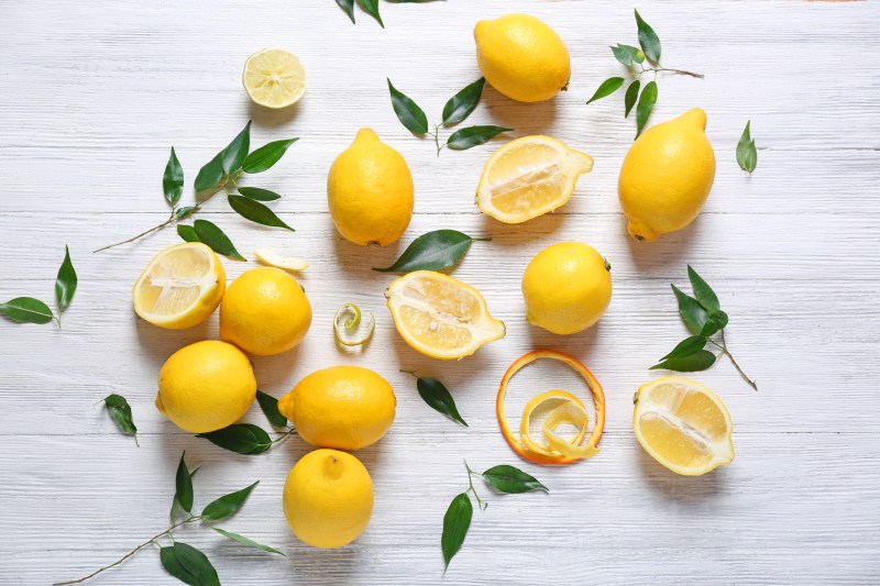 Fresh lemons on wooden table