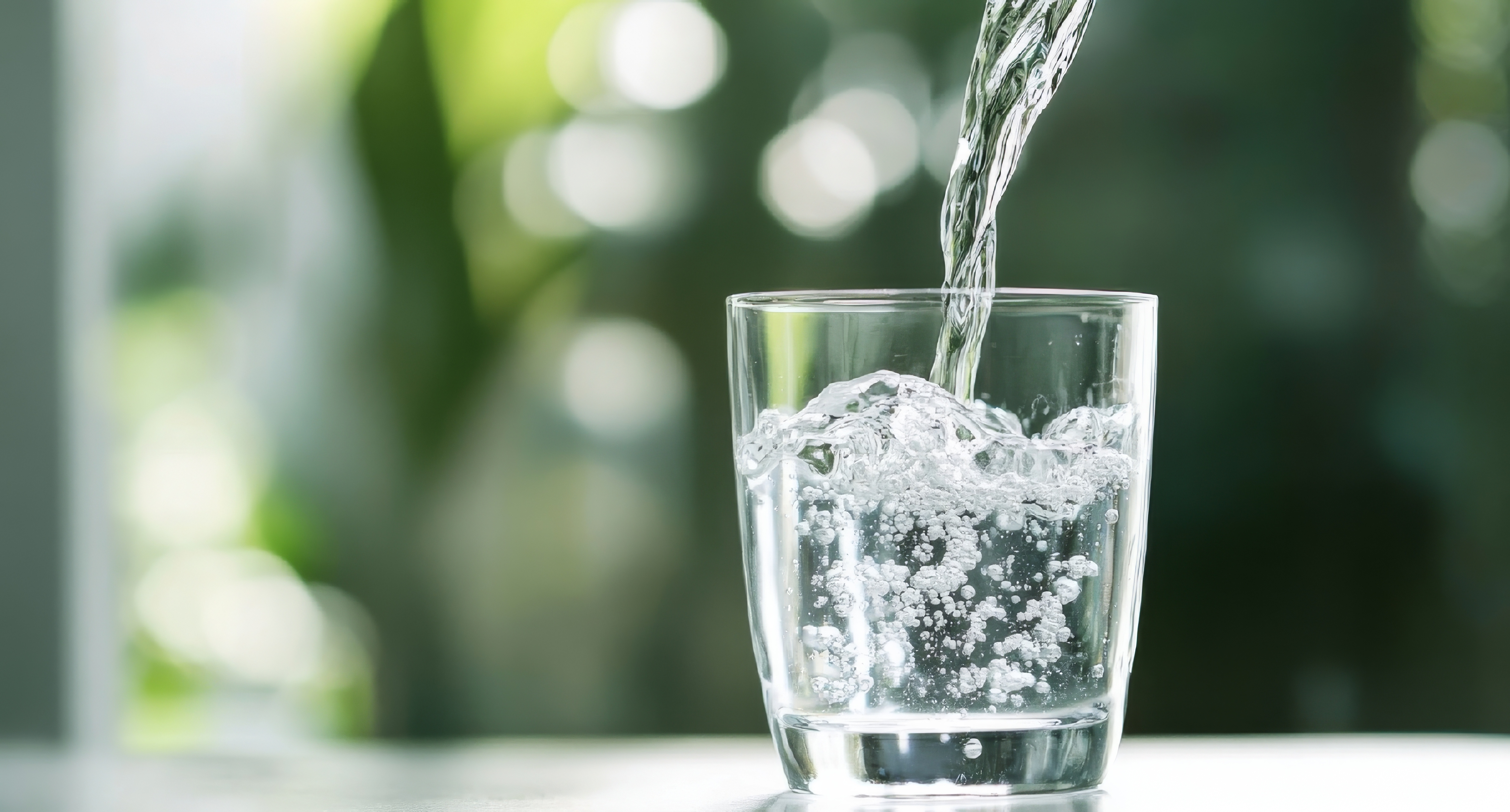 Pouring water into a glass