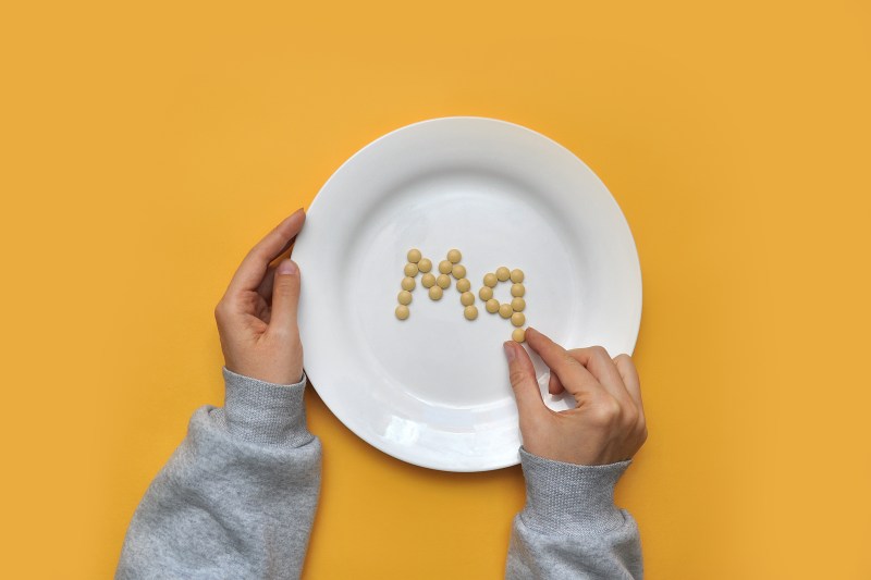 Magnesium supplements on a dinner plate