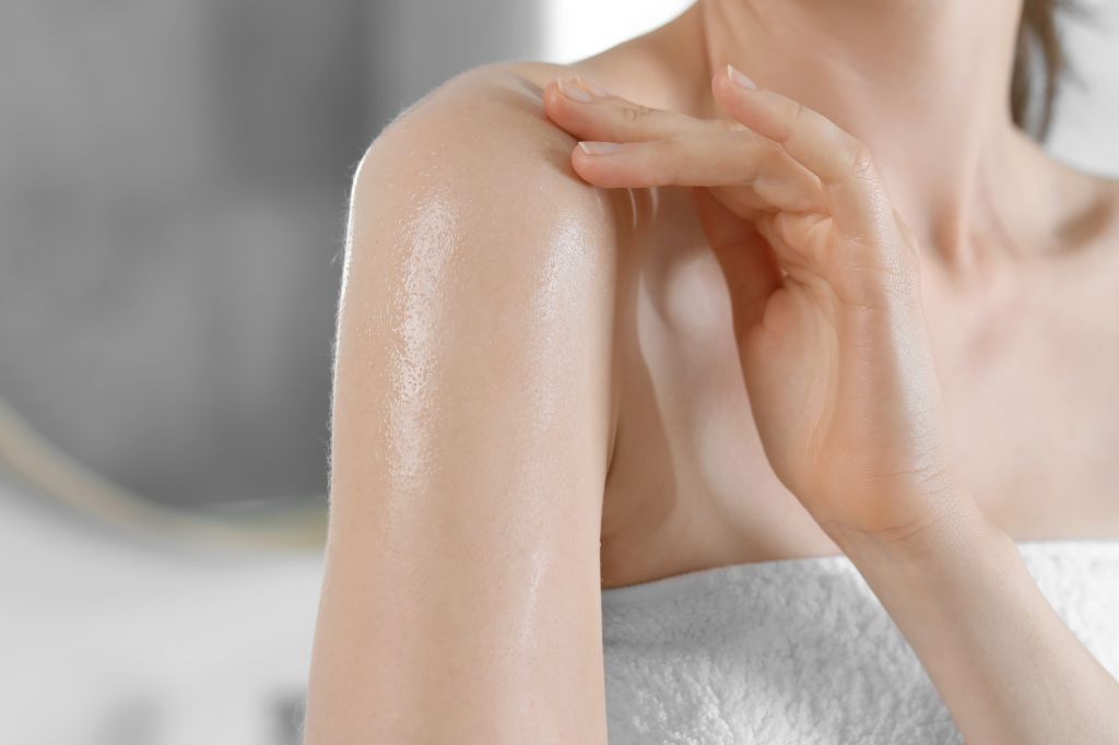 Applying oil to skin 