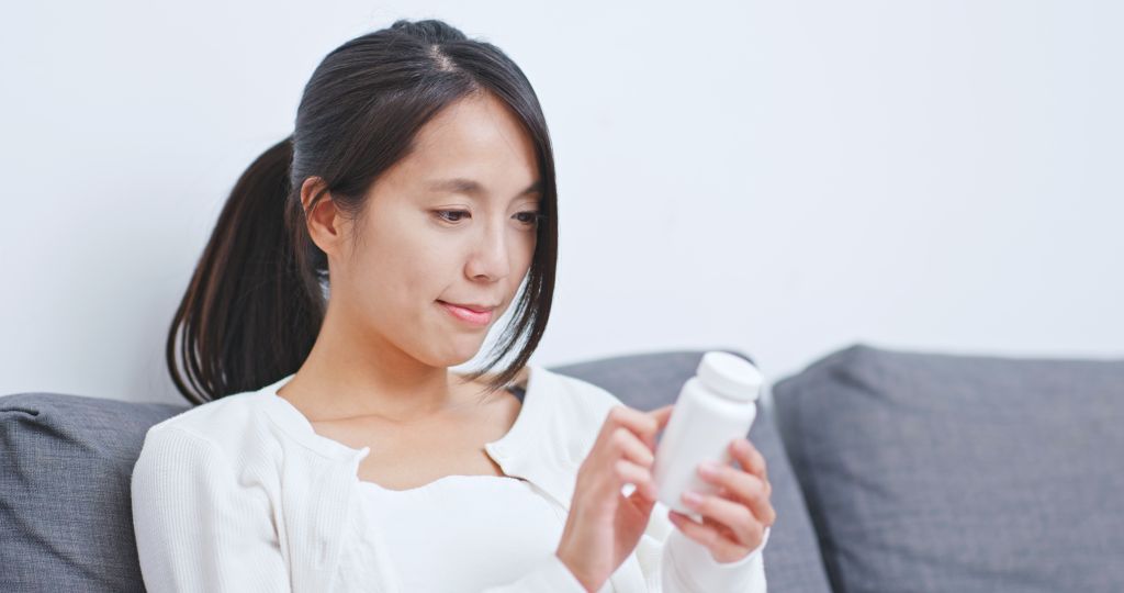 Woman reading label  