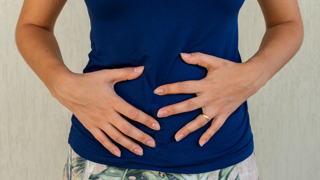 Woman touching her stomach
