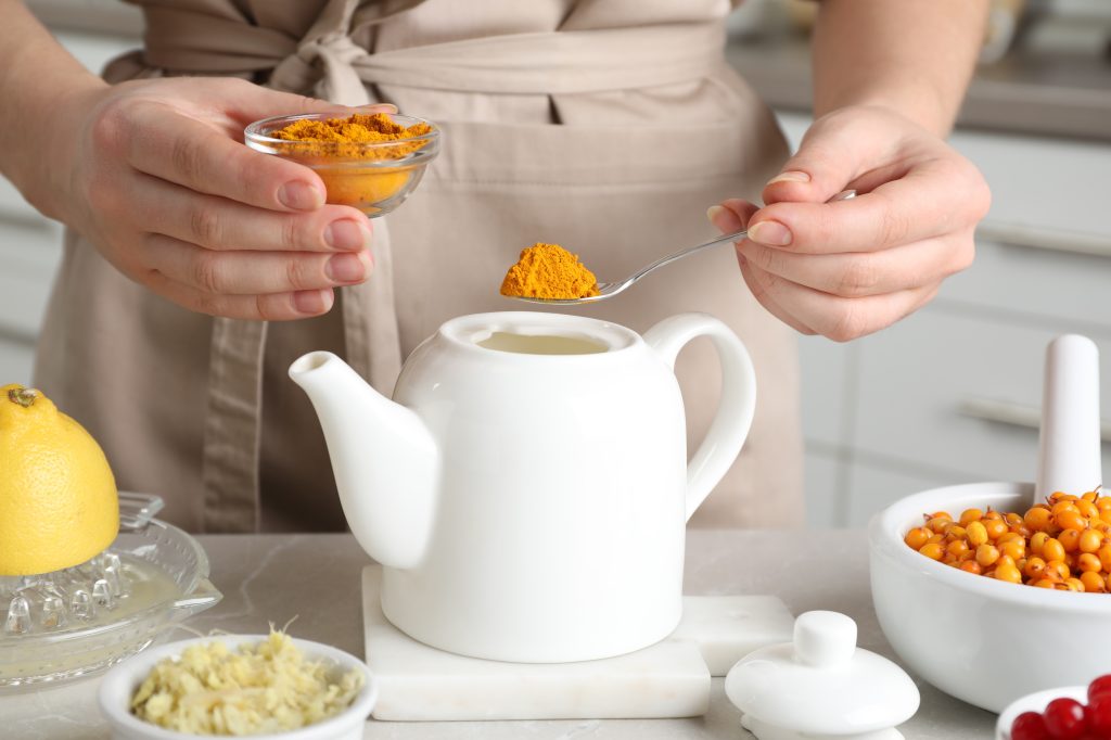 Woman making turmeric tea