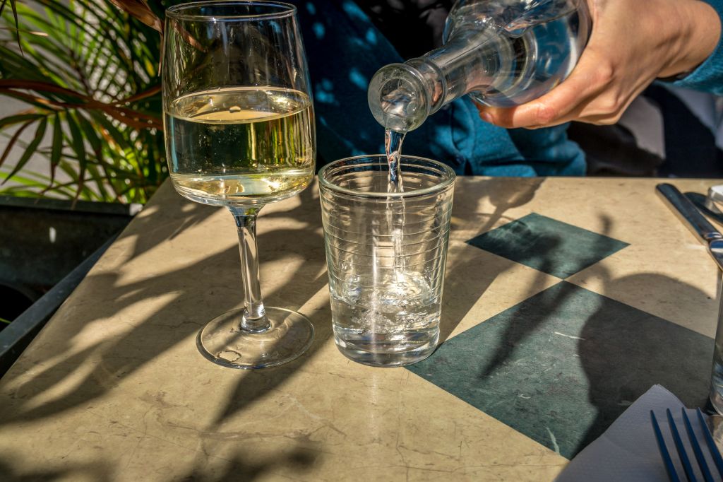 Glass of wine next to a glass of water