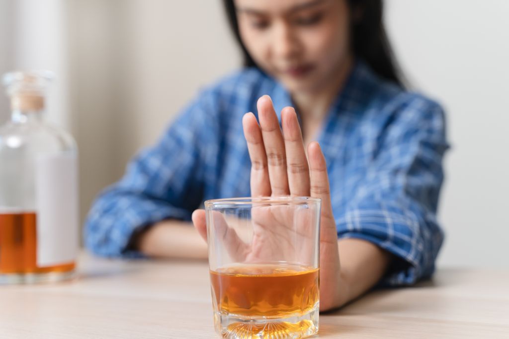 Woman saying no to alcohol