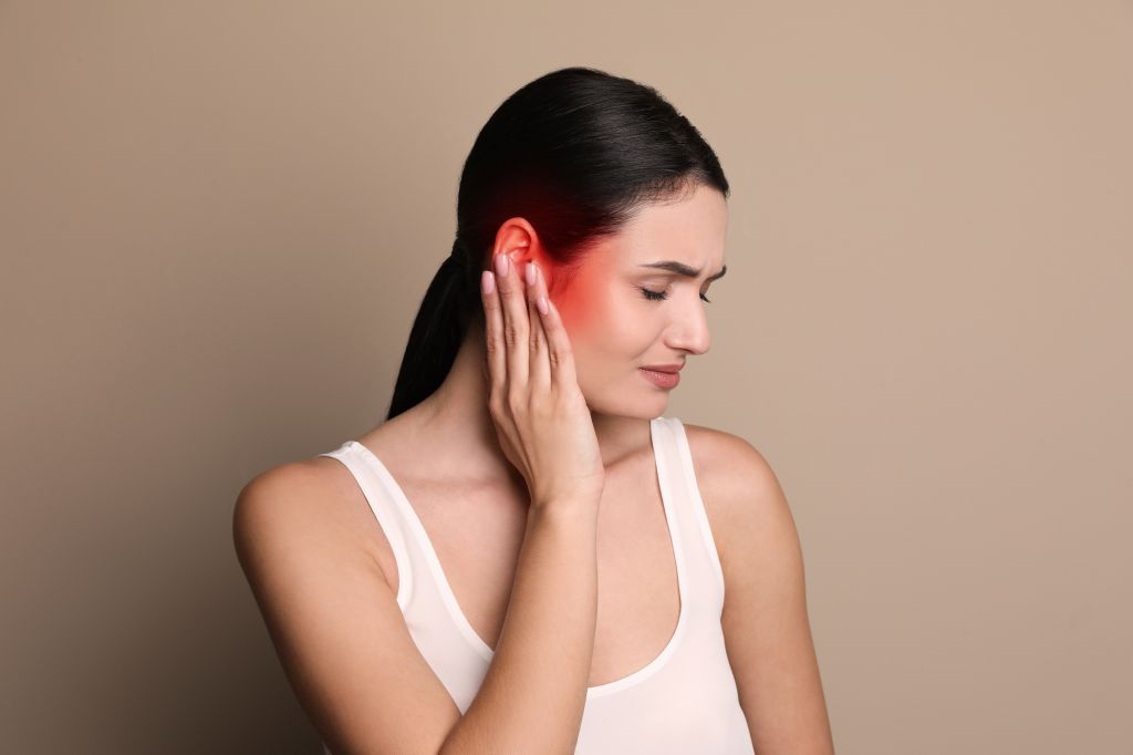 Woman with ear pain