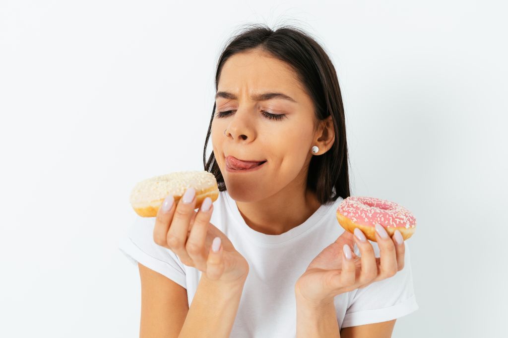 Woman holding donuts 