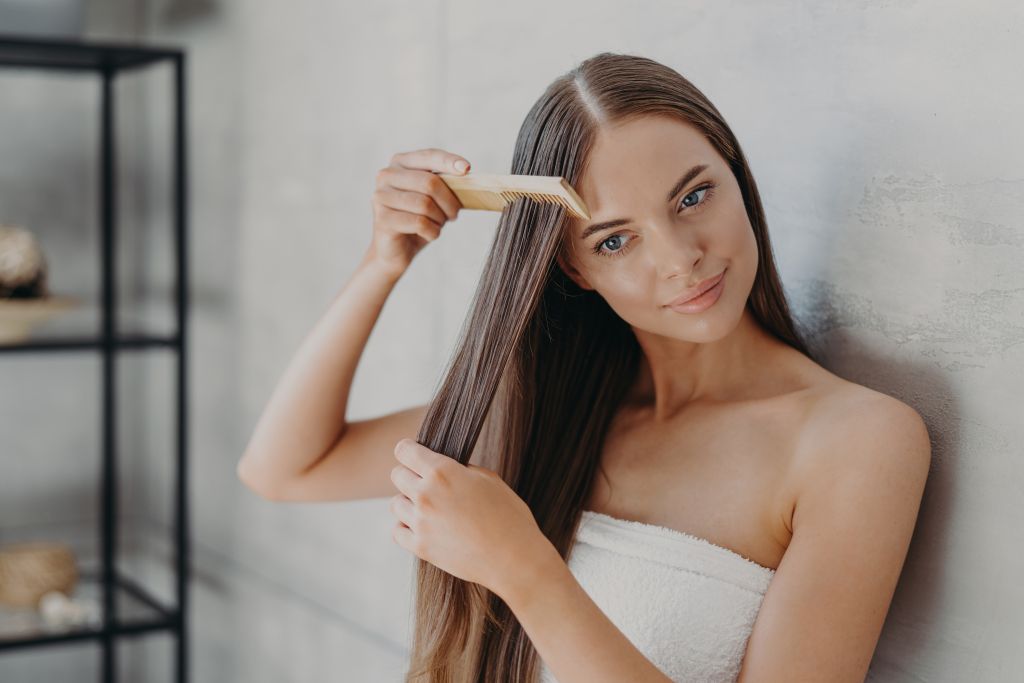 Woman brushing hair 