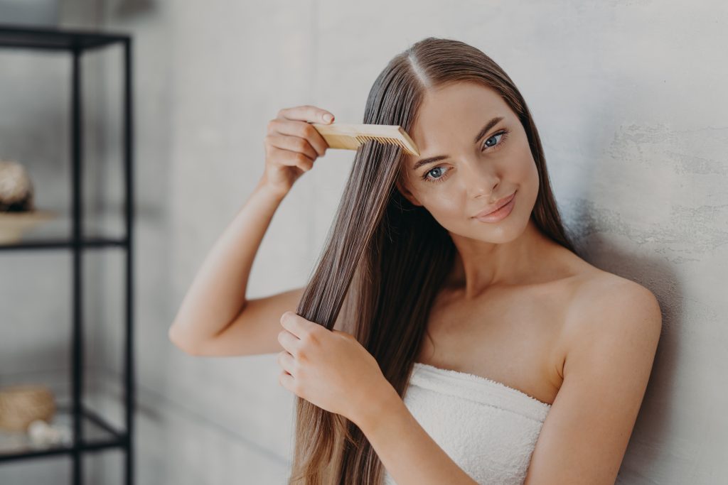 Woman brushing hair 