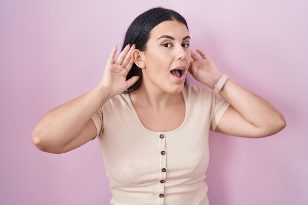 Woman yawning to help regulate pressure in ear tubes