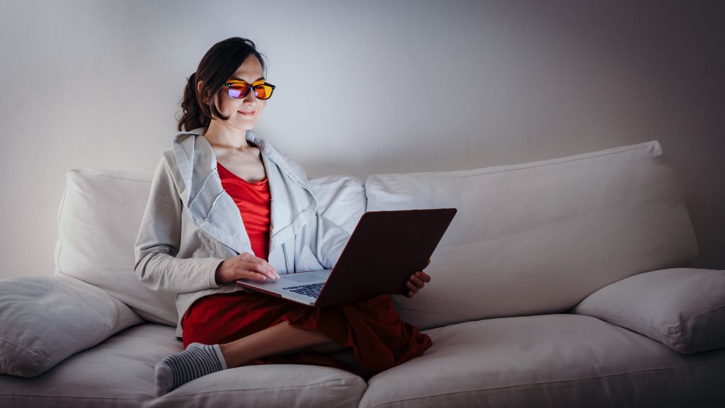 Woman wearing blue light blocking glasses