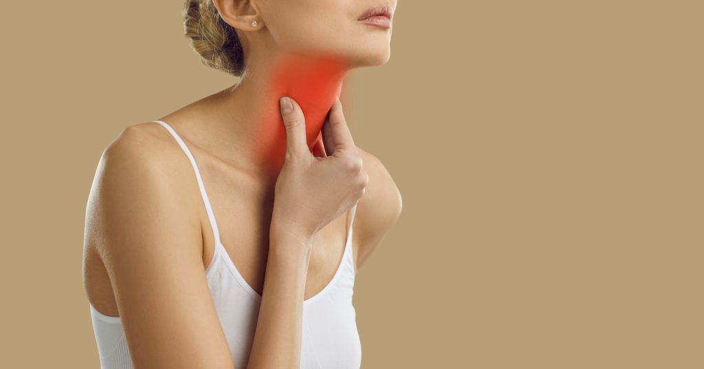 Woman with throat pain  
