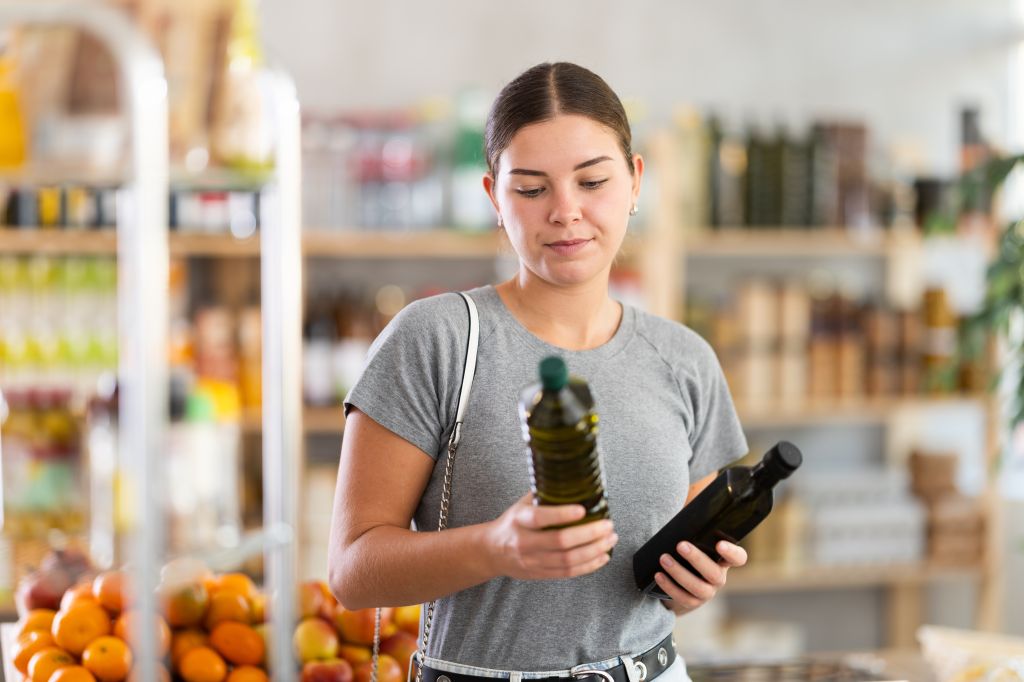 Girl buying olive oil 