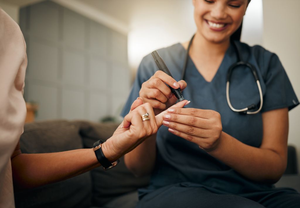 Doctor testing blood sugar levels  