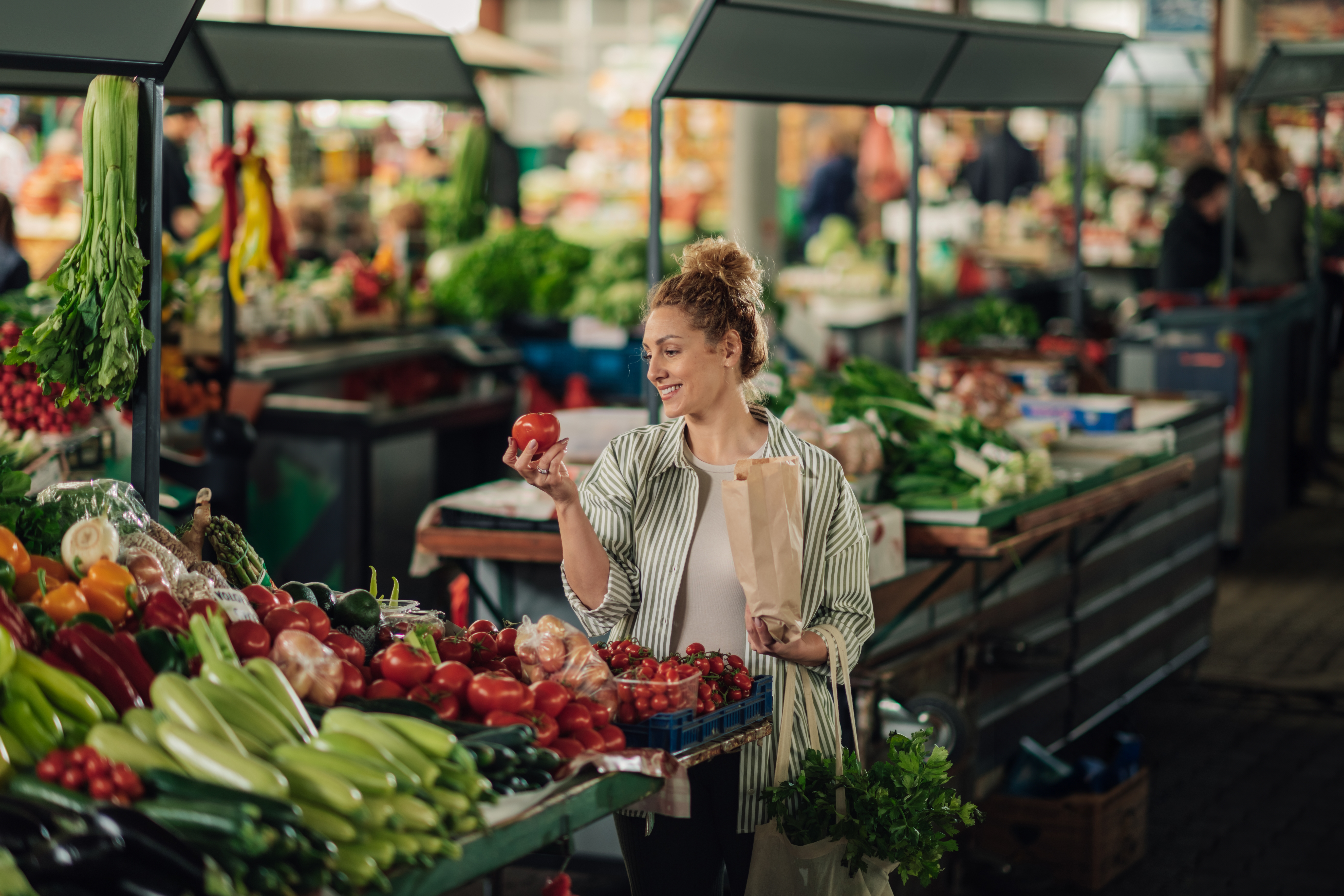 Woman buying vegetables  