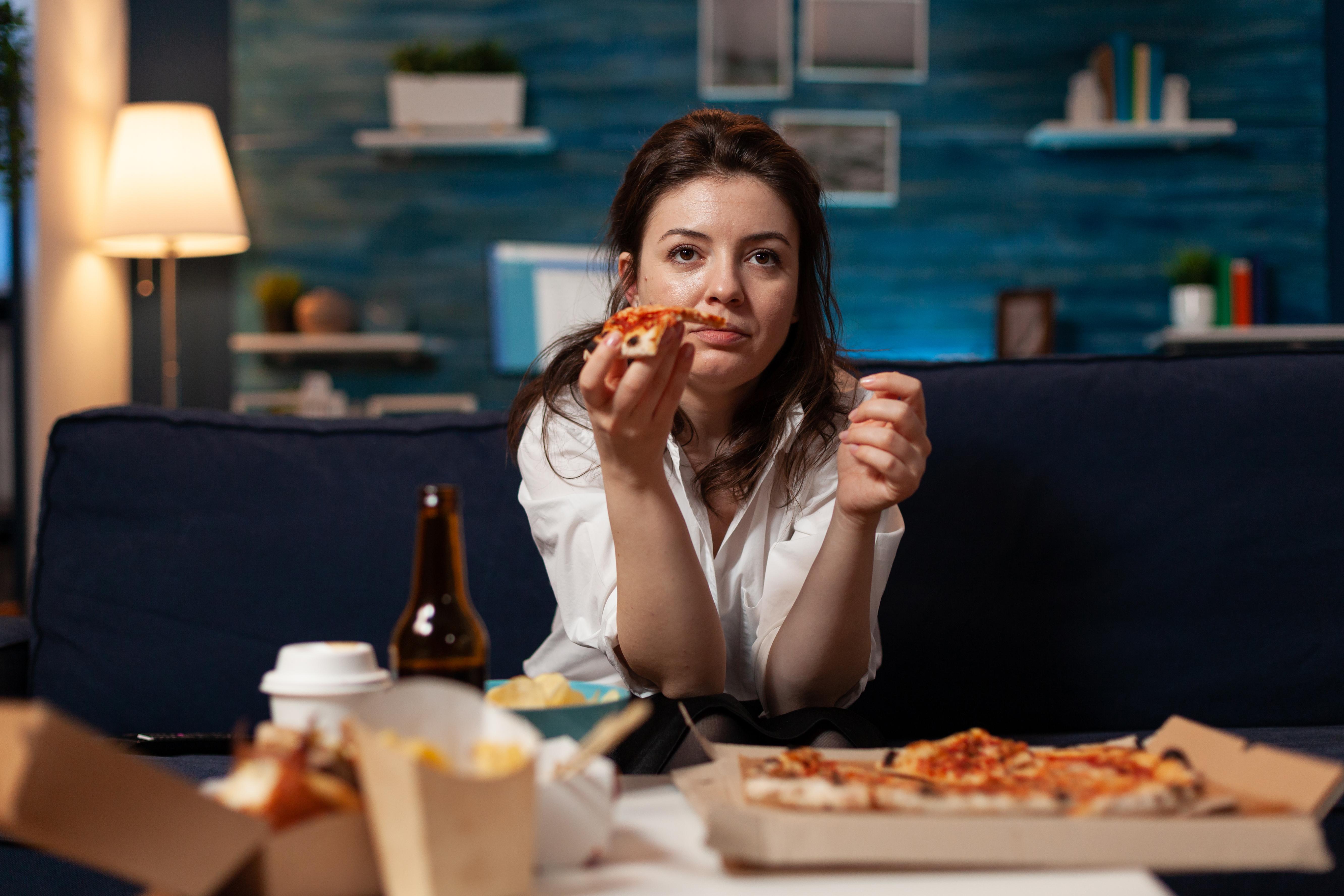 Woman eating junk food  