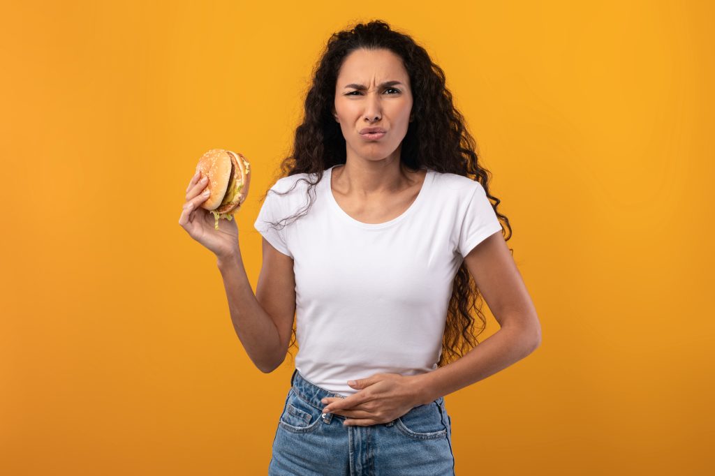 Woman eating junk food