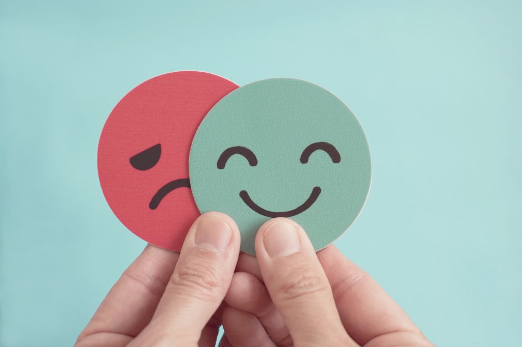 Happy face and sad face cutouts  