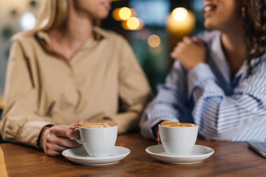 Two women drinking coffee